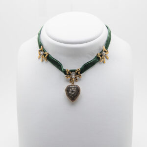 Green velvet choker with gold and silver motifs and diamonds